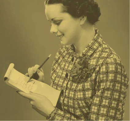 Woman writing on a notepad